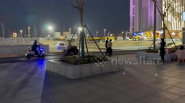 Police seen chasing a candied haw seller in Henan, China