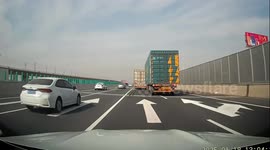 Dashcam captures truck crashing into and destroying road wall on Henan, China