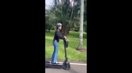 Woman loses balance and falls off electric scooter in Bogor, Indonesia