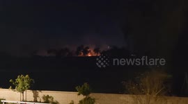 Wildfire seen from Dallas Cowboys training fields in Oxnard, California