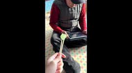 Grandfather's dentures hilariously fall out while eating candy in Liaoning, China