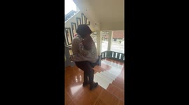 Two friends trip and fall on stairs in Malang, Indonesia