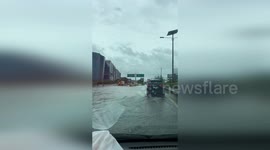 Heavy rain floods road around Jakarta airport in Indonesia