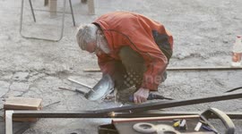 Construction worker Welding metal fence