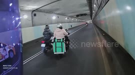 Delivery rider's food box tumbles from the back of bike