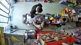 Shopkeeper rushes outside to save elderly woman rolling back on vehicle
