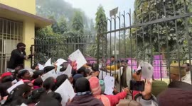 Pupils arriving late to exams are whacked with canes as they force their way inside