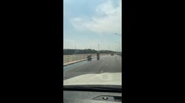 Shopper stacks fruit and veg on his motorbike to ride home