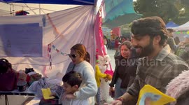 Girl accidentally hit by flying can during throw ball game at carnival in East Delhi, India