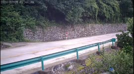 Huge rock rolls down hill and destroys yard in Hubei province, China