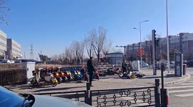 Man kicks parked electric motorcycles in Datong, Shanxi province