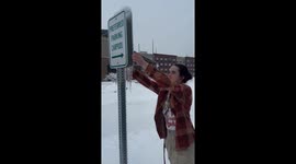 Friend shatters ice sheet at Southern Illinois University