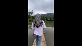 Woman falls while filming content on wooden platform in Sumedang, Indonesia