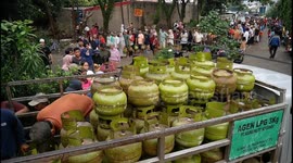 Residents queue from morning to evening to buy 3 kg of subsidized gas in Tangerang, Indonesia