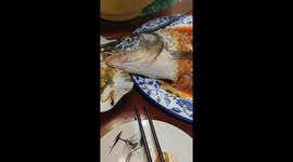 Fish moves on plate after being eaten in Jiangsu Province, China