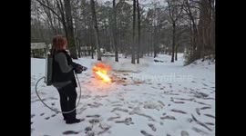Woman uses flamethrower to clear snow in Trussville, Alabama, USA