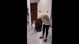 Toddler cries after not recognizing father in wig in Jilin, China