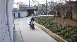 Motorcyclist crashes into building door in Shaanxi province, China