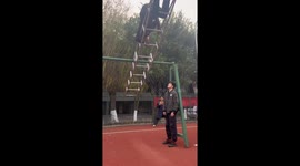 Student practices daily aviation training on 360° rotating swing in Sichuan, China