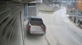 Motorcycle and car collision captured on security video in Guizhou, China