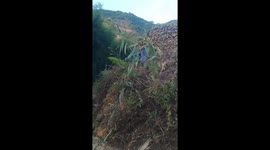 Overloaded truck overturns at logging site in Guangxi, China