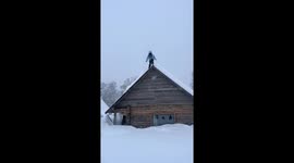 Person jumps from roof into deep snow in Xinjiang province, China