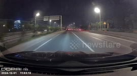 Driver avoids large hole on road in Guangzhou, China