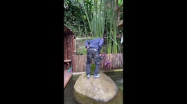 Man slips and falls into pond while posing in Pangalengan, West Java, Indonesia