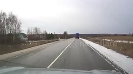 Massive black container falls off lorry and is destroyed by oncoming rubbish truck