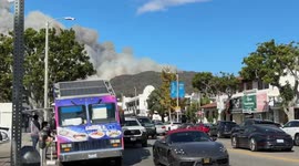 Visible smoke from growing wildfire in Pacific Palisades, California, USA