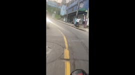 Near collision between motorcycle and biker in Bogotá, Colombia