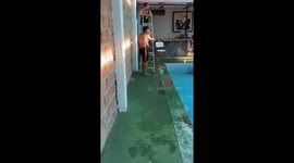 Man falls attempting to swing from roof bar above pool in Teocaltiche, Mexico