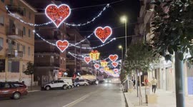 Heart-shaped lights illuminate one of the shopping streets of Lido di Ostia in the evening in the days leading up to Valentine's Day in Rome.