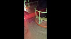 Friend spins wildly on playground carousel in Hebei, China
