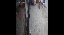 Motorcyclist crashes and falls into glass door in Hiep Phuoc, Dong Nai, Vietnam