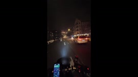 Motorbike ride through fireworks display as New Year 2025 is welcomed in Neukölln, Germany