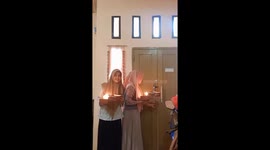 The girl accidentally set her handkerchief on fire while preparing a surprise for a friend!