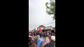 A man at a carnival in a traditional costume did not see the girl and crashed into her!