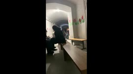 People sing songs in the shelter during the shelling in the Ternopil region