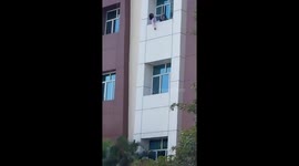 Security guards save distressed woman on window ledge