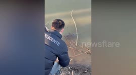 Angler pulls frozen 20lbs calf from ice-covered lake in China