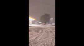 Skiers Pulled by Vehicle on Street