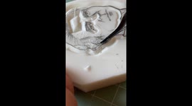 Artist carves out detailed portrait stamps from small erasers