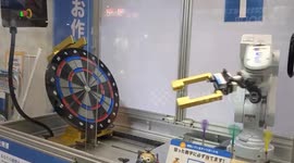 Impressive moment robot plays dart game