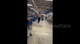Huge hailstones smash through supermarket roof sending customers fleeing in Argentina