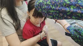 Steady 3-year-old girl ears piercing without crying