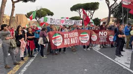 Protesters behind the banner with the slogan 'No war, no Nato' during the protest against the ongoing wars and to reiterate that 'Italy repudiates war' organized by the anti-establishment political party Sovereign Popular Democracy in Rome.