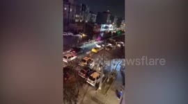 Naked Iranian woman stands on police car in protest over female rights