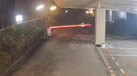 British tourist, 55, who moaned about Thai police cells 'seen on CCTV attacking car park barrier'