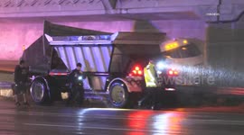 US, Los Angeles: Sun Valley Dump Truck Jackknifes Into Center Divider in Hazardous Rainy Freeway Conditions